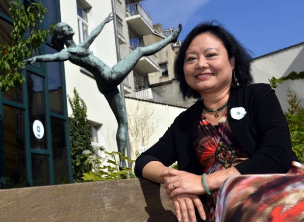 Kim Phuc poses after a meeting of the women's council 'Vrouwenraad' on August 30, 2013 in Brussels. Vrouwenraad invited Vietnamese born Canadian Phan Thi Kim Phuc for a q&a session, she is the girl pictured in an iconic picture taken by photographer Nick Ut during a napalm strike in the Vietnam war. AFP PHOTO/BELGA /ERIC LALMAND (Photo credit should read ERIC LALMAND/AFP/Getty Images)