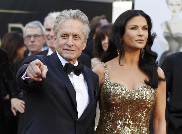 Catherine Zeta Jones and Michael Douglas arrive at the 85th Academy Awards in Hollywood, California February 24, 2013. REUTERS/Adrees Latif (UNITED STATES TAGS:ENTERTAINMENT) (OSCARS-ARRIVALS)
